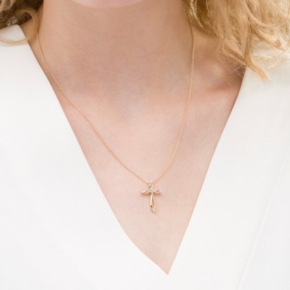 1/10 CT. T.W. Diamond Looped Cross Pendant in 10K Gold - Picture 2 of 2